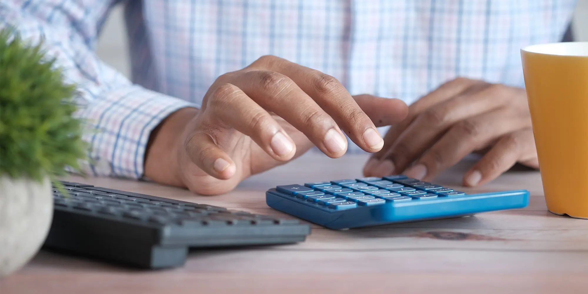 man performing an IRS audit with a calculator